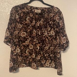 Brown floral top with pleating detail and flowy sleeves